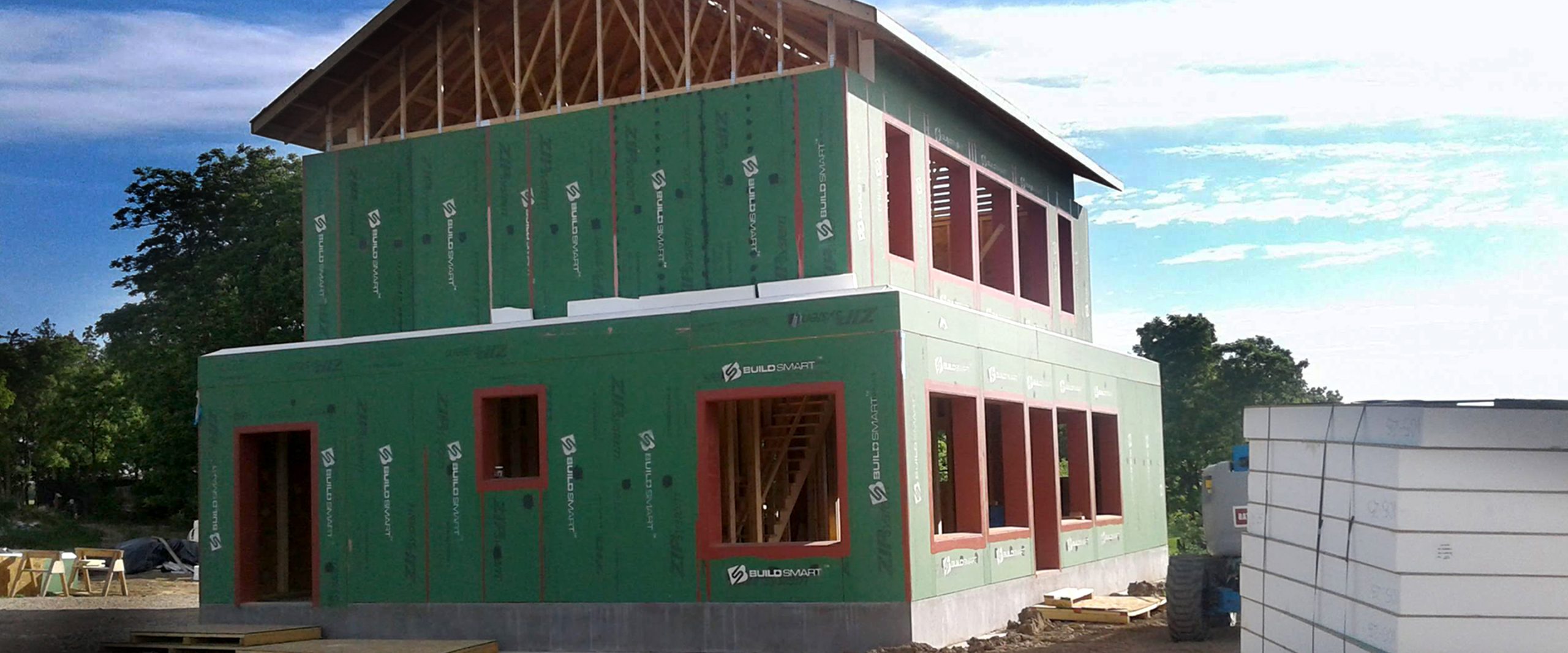 BuildSMART-Building-SMART-Build-SMART-J-Form-Underslab-Insulation-Vapor-Barrier-Gravel-Bed-and-concrete-slab-on-grade-contractor-Horizontal-Wing-Insulation-high-performance-wall-panel-building-envelope-E-Wall-buildsmartna.com-Passive-House-energy-efficiency-net-zero-J-Form-insulated-permanent-shallow-foundation-Form-System-prefabrication-prefab-modular-construction-Developer-Architect-Builder-Homeowner-Exterior-Wall-Panel-Interior-Frame-Walls-Single-Family-Multifamily-Senior-Living-Assisted-Care-Daycare-Clinic-Student-Living-School-Office-Hospitality-Mixed-Use-Slab-On-Grade-Crawl-Space-Basement-Piers-Column-Walk-Out-Basement-Energy-Star-LEED-WELL-Living-Building-Challenge-FORTIFIED-Thermal-Efficiency-Labor-Savings-Low-risk-air-barrier-and-very-low-infiltration-rates-severe-weather-survivability-sound-attenuation-and-a-quiet-secure-feeling-inside-low-cost-of-ownership-optimized-construction-cost-and-operation-cost-total-cost-of-ownership-optimized-cash-flow-and-return-on-investment-construction-drawings-Floor-Plans-scale-and-dimension- Elevations-Wall-Section-Window-Door-Schedule-Section Details-Lender-Structural Engineer-MEP Engineer-Energy Modeler-Energy-Rater-Resilience-zero-carbon-Panelized-Passive-House-Multifamily-Prefabricated-Modular-Offsite-construction-Off-site-construction-Code-comparison-Financial-analysis-Return-on-investment-ROI-Internal-rate-of-return-IRR-Real-estate-valuation-Cash-flow-Pro-forma-Financial-terms-in-attached-documents-Noise-Sound-proofing-NIMBY-Health -Ventilation-Section-8-Voucher-program-Build-to-Rent-All-AIA-education-credits-Health-Safety-Welfare-credits-HSW-NIMBY-Ventilation-Noise-Soundproofing